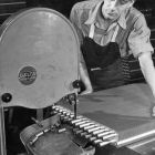 Sawing off heater coil tubes.