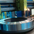 Operator is brushing off a centrifugal fan hub on the Froriep.