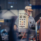 Large centrifugal shaft milling by lathe operator.