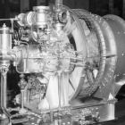 WW2 Naval officer inspecting a mechanical draft turboblower.