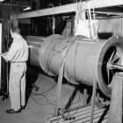 Worker taking multiple manometer readings on this small axial fan.