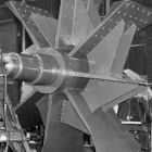 Static balancing of wheel and shaft assembly on sleeve bearings.