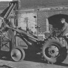 Coal tractor filling bin which is connected to the powerplant by a bucket elevator.